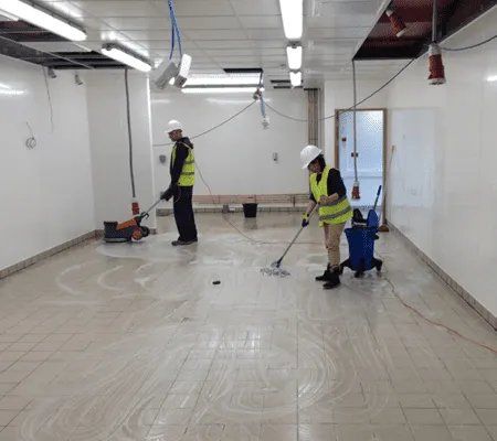 Post-construction cleaning crew on commercial job site