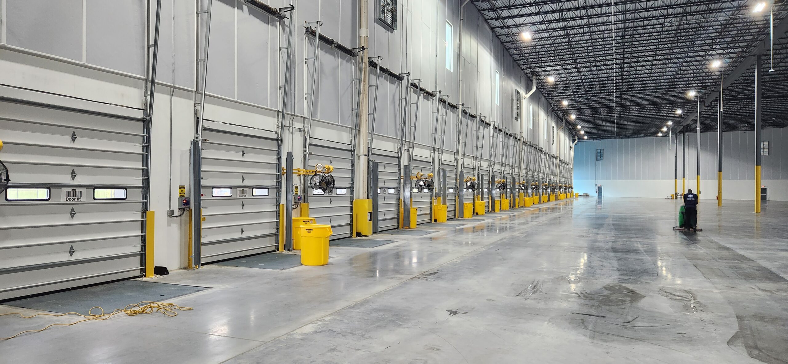 Warehouse post-construction cleanup with reflective concrete floors - Final Phase